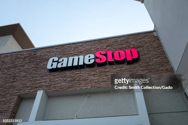 Facade with sign and logo at Game Stop video gaming store in Dublin, California, August 23, 2018.