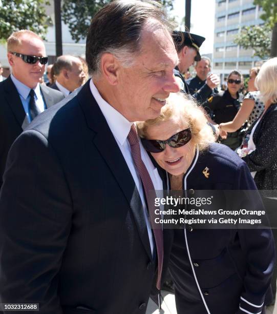 Orange County District Attorney Tony Rackauckas gets a hug from Collene "Thompson" Campbell during the 6th Annual Victim's Rights March and Rally in...