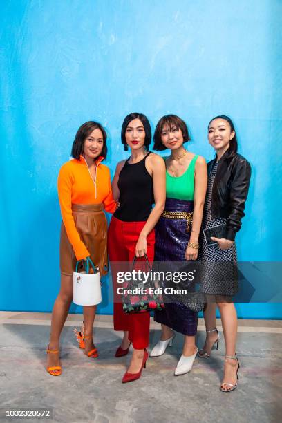 Laureen Uy, a guest, Liz Uy and Yuyu Zhangzou attend the MICHAEL KORS COLLECTION Spring 2019 Runway Show, Asia Pacific Front Row Faces at Pier 17 on...