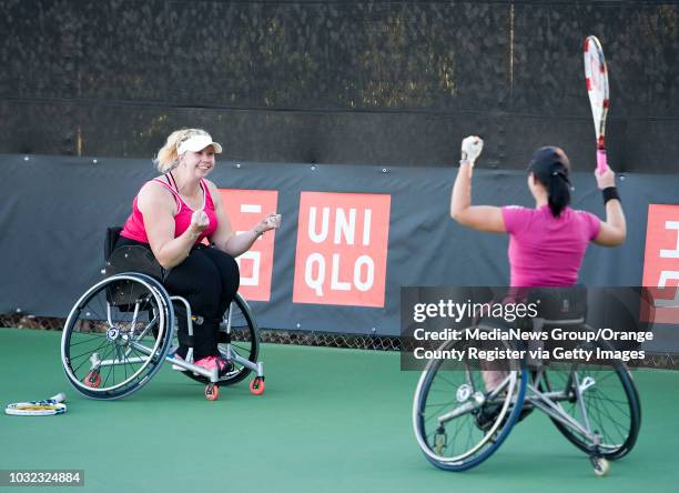 Louise Hunt, left, and Katharina Kruger, of Germany, celebrate their doubles semi-final victory over Marjolein Buis and Michaela Spaanstra, of the...