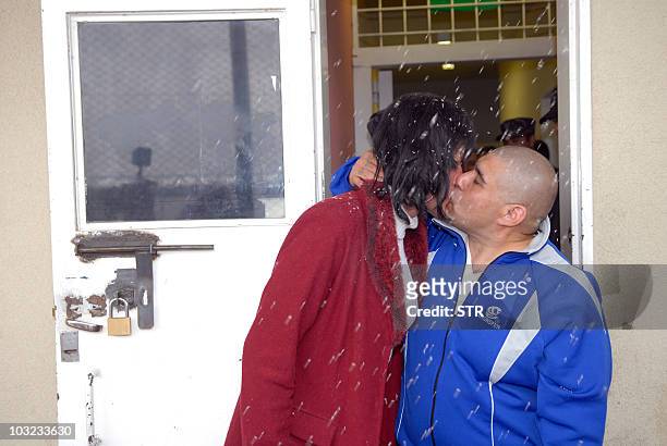 Transvestite and ex inmate Diana Acuna Talquenca and prison inmate Osvaldo Martin Torres, kiss each other after their marriage at Almafuerte prison,...