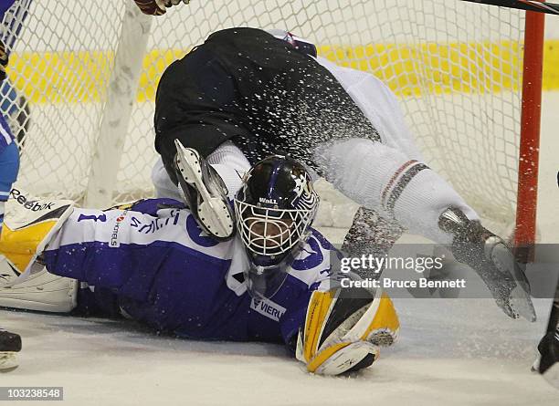 Brandon Saad of Team USA flies over Jonathan Iilahti of Team Finland at the USA Hockey National Evaluation Camp on August 4, 2010 in Lake Placid, New...