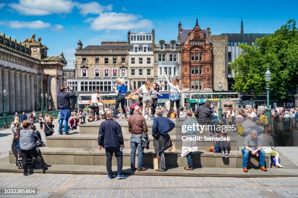 flash mob dancers in downtown edinburgh scotland uk - flash mob stock pictures, royalty-free photos & images