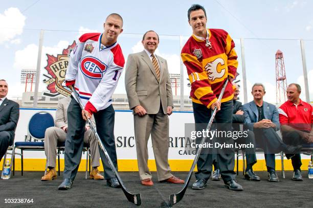 Commissioner Gary Bettman stands for a photo with Josh Gorges of the Montreal Canadiens and Steve Staios of the Calgary Flames at the NHL Heritage...