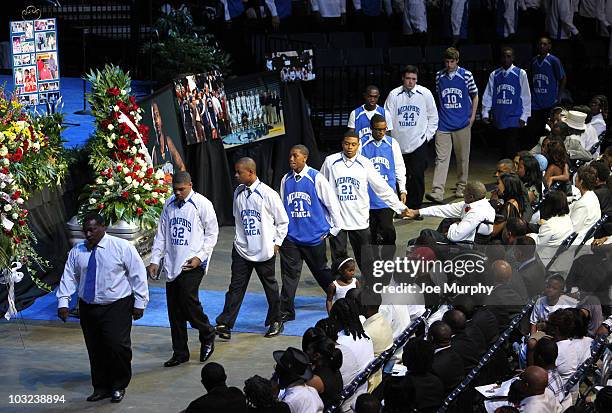 Members of the local YMCA shake hands with Herbert Wright, father of Lorenzen Wright during a memorial service honoring the life of Lorenzen Wright...