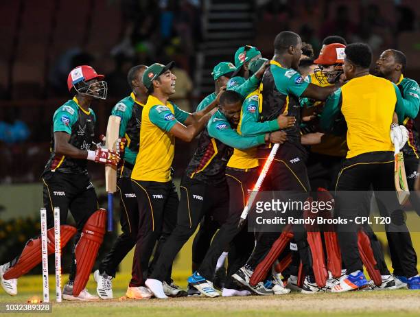 In this handout image provided by CPL T20, St Kitts & Nevis Patriots celebrate winning the Hero Caribbean Premier League Play-Off match 32 between St...