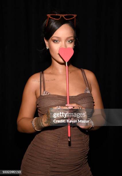 Rihanna poses backstage for the Savage X Fenty Fall/Winter 2018 fashion show during NYFW at the Brooklyn Navy Yard on September 12, 2018 in Brooklyn,...