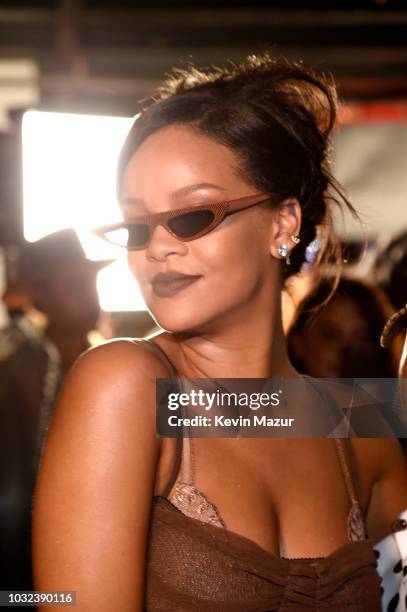 Rihanna poses backstage for the Savage X Fenty Fall/Winter 2018 fashion show during NYFW at the Brooklyn Navy Yard on September 12, 2018 in Brooklyn,...