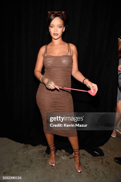 Rihanna poses backstage for the Savage X Fenty Fall/Winter 2018 fashion show during NYFW at the Brooklyn Navy Yard on September 12, 2018 in Brooklyn,...