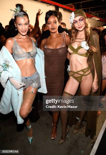 Bella Hadid, Rihanna and Gigi Hadid pose backstage for the Savage X Fenty Fall/Winter 2018 fashion show during NYFW at the Brooklyn Navy Yard on...