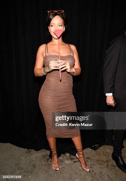 Rihanna poses backstage for the Savage X Fenty Fall/Winter 2018 fashion show during NYFW at the Brooklyn Navy Yard on September 12, 2018 in Brooklyn,...