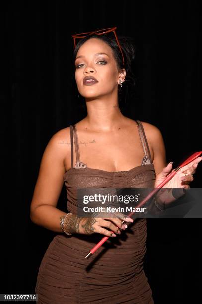 Rihanna poses backstage for the Savage X Fenty Fall/Winter 2018 fashion show during NYFW at the Brooklyn Navy Yard on September 12, 2018 in Brooklyn,...