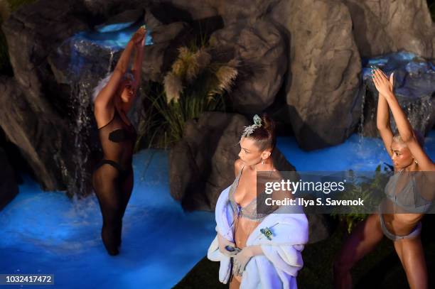 Model Bella Hadid poses with models on the runway for the Savage X Fenty Fall/Winter 2018 fashion show during NYFW at the Brooklyn Navy Yard on...