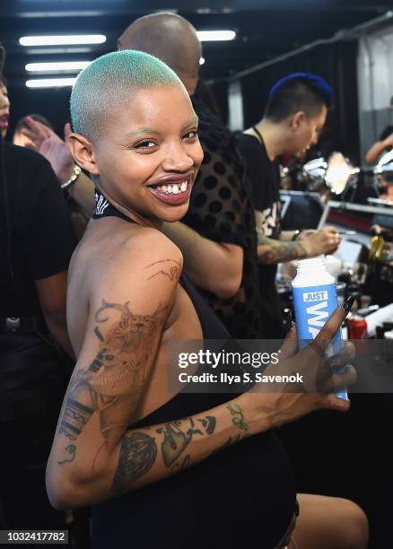 Model Slick Woods poses backstage for the Savage X Fenty Fall/Winter 2018 fashion show during NYFW at the Brooklyn Navy Yard on September 12, 2018 in...