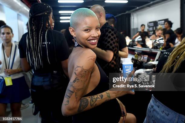 Model Slick Woods poses backstage for the Savage X Fenty Fall/Winter 2018 fashion show during NYFW at the Brooklyn Navy Yard on September 12, 2018 in...