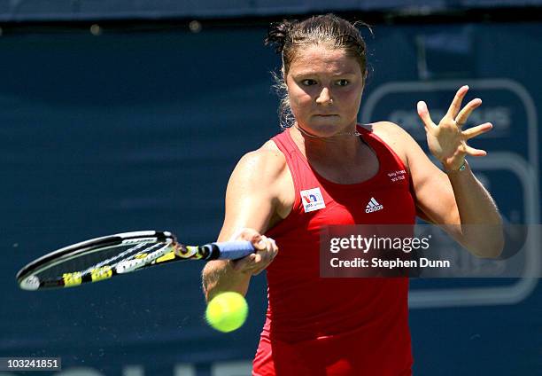 Dinara Safina of Russia returns a shot to Agnieszka Radwanska of Poland during their match in the Mercury Insurance Open at La Costa Resort and Spa...