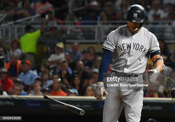 Dejected New York Yankees Outfield Giancarlo Stanton throws his bat after striking out during a MLB game between the Minnesota Twins and New York...