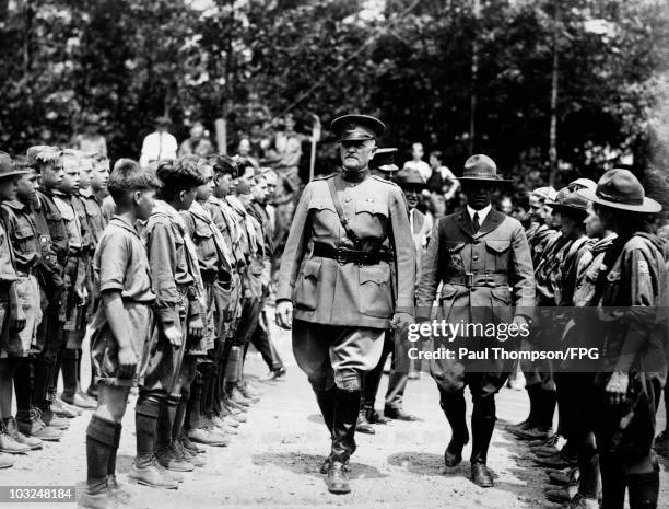 General John J. Pershing reviews the boys at their camp on Bear Mountain, New York State, during the National Council of the Boy Scouts of America,...