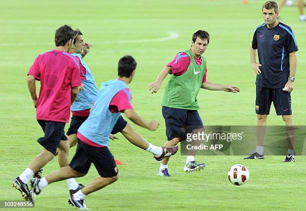 Barcelona's Argentinian midfielder Lionel Messi passes the ball during a light training session with teammates and coaches at the Worker's Stadium in...