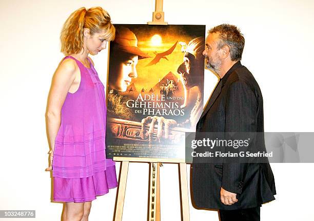 Actress Louise Bourgoin and director Luc Besson attend the photocall of 'The Extraordinary Adventures of Adele Blanc-Sec' at Hotel de Rome on August...