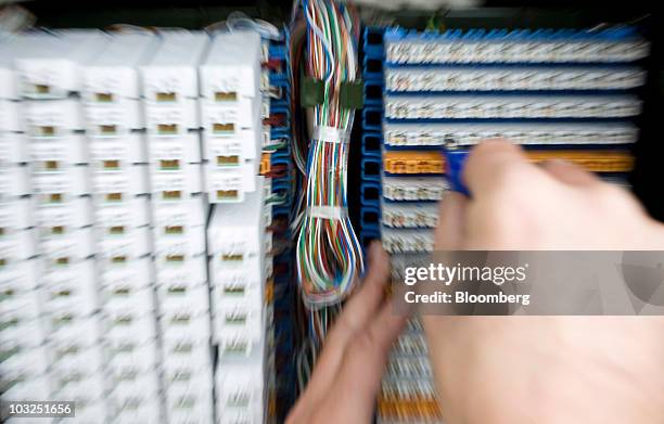 An engineer for BT Openreach part of the BT Group Plc connects customers to a high speed fibre optic network in Enfield, U.K., on Thursday, Aug. 5,...