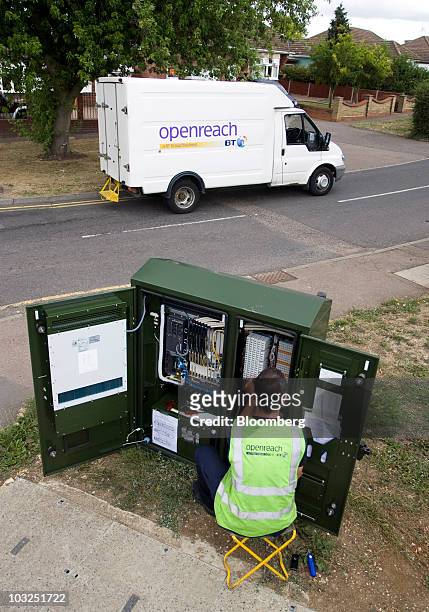 An engineer for BT Openreach part of the BT Group Plc works on a network cabinet in Enfield, U.K., on Thursday, Aug. 5, 2010. BT Group Plc, the...
