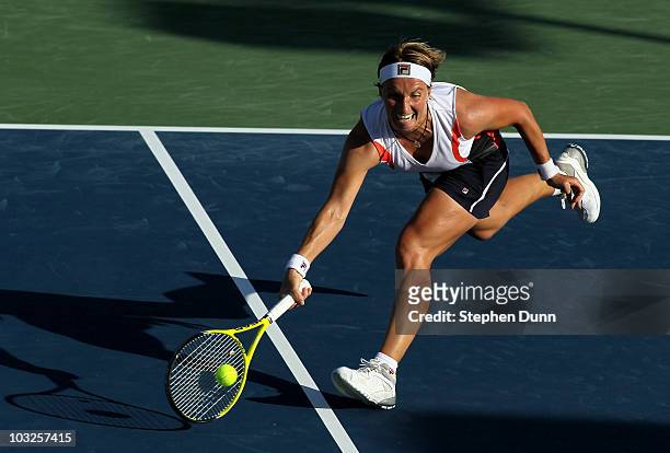 Svetlana Kuznetsova of Russia charges to dig out a shot from Sara Errani of Italy during their match in the Mercury Insurance Open at La Costa Resort...