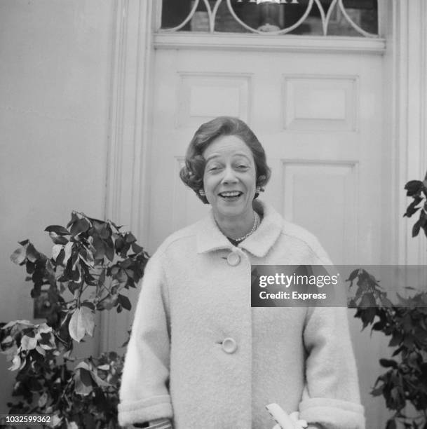 American socialite and philanthropist Brooke Astor , widow of Vincent Astor, pictured in front of the door of a house on 19th April 1963.