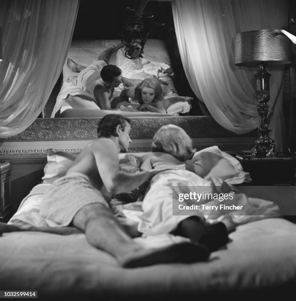 Scottish actor Sean Connery and Italian actress Daniela Bianchi rehearse and film a bedroom scene for the James Bond film 'From Russia With Love' at...