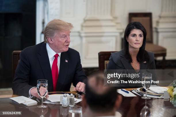 President Donald Trump, joined by U.S. Ambassador to the UN Nikki Haley, right, speaks during a lunch with the United Nations Security Council in the...