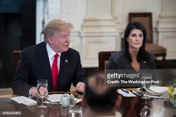 President Donald Trump, joined by U.S. Ambassador to the UN Nikki Haley, right, speaks during a lunch with the United Nations Security Council in the...