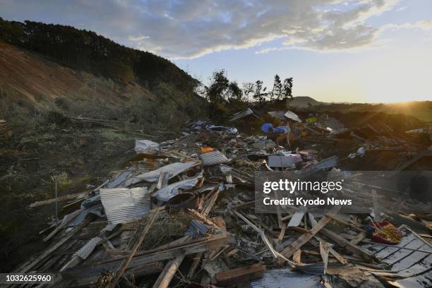 Debris is strewn around a residential area of Atsuma, Hokkaido, on Sept. 13 one week after a landslide triggered by a strong earthquake hit the area....