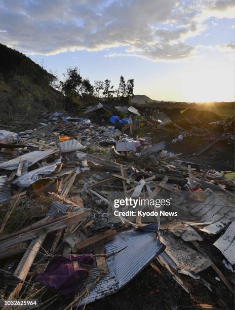 Debris is strewn around a residential area of Atsuma, Hokkaido, on Sept. 13 one week after a landslide triggered by a strong earthquake hit the area....