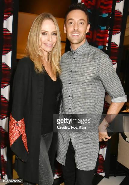Tonya Kinzinger and Maxime DereymezÊattend the Stefanie Renoma Exhibition Preview Party at Le Masha Club on September 12, 2018 in Paris, France.