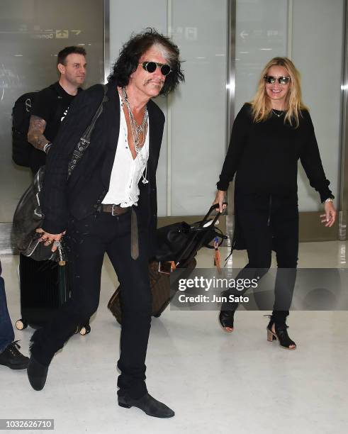 Joe Perry and Billie Paulette Montgomery are seen upon arrival at Narita International Airport on September 13, 2018 in Narita, Japan.