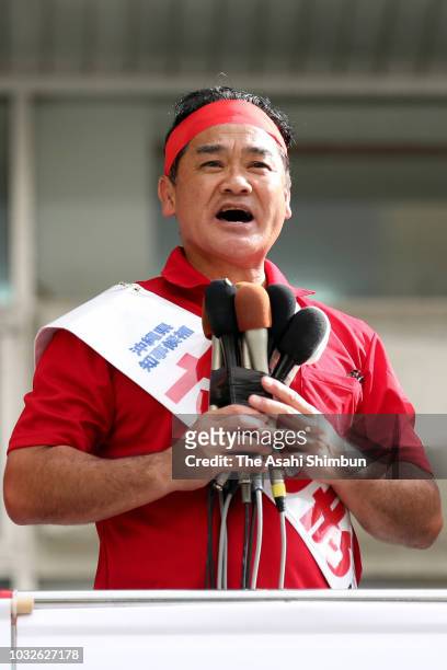 Ruling Liberal Democratic Party backed candidate Atsushi Sakima makes a street speech calling for support as the Okinawa gubernatorial election...