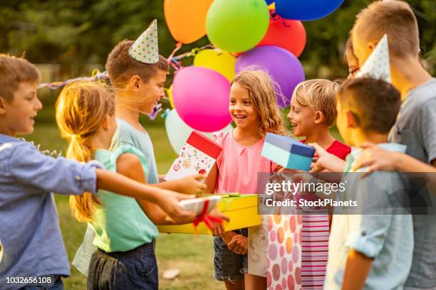 children came to birthday party with presents - kids birthday present stock pictures, royalty-free photos & images