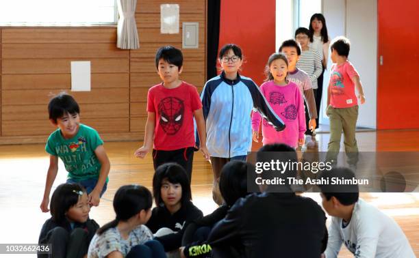 School pupils return to school a week after the magnitude 6.7 earthquake on September 13, 2018 in Abira, Hokkaido, Japan. Concerns are rising about...