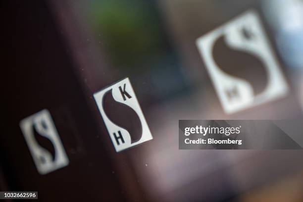 The Sun Hung Kai Properties Ltd. Logo is displayed on the Sun Hung Kai Centre building in Hong Kong, China, on Thursday, Sept. 13, 2018. Sun Hung...