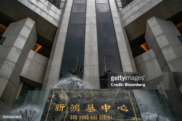 Sign stands at the Sun Hung Kai Centre building, which houses the Sun Hung Kai Properties Ltd. Headquarters, in Hong Kong, China, on Thursday, Sept....