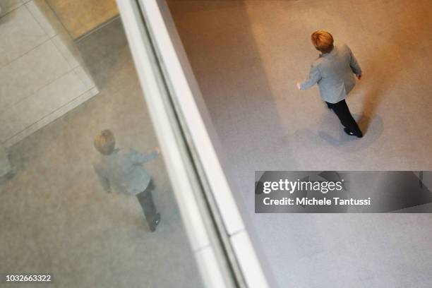 German Chancellor Angela Merkel leaves a session of the German Parliament or Bundestag on September 13, 2018 in Berlin, Germany. Relations within the...