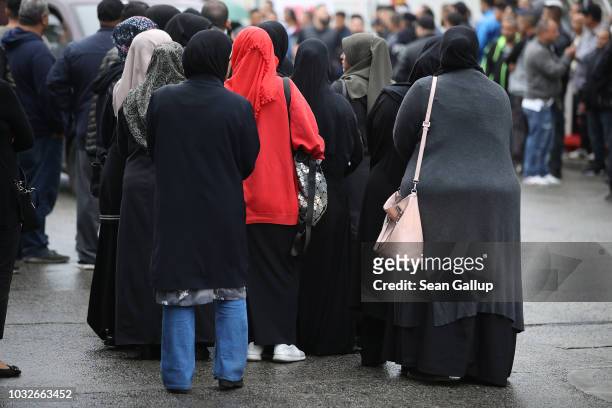 Mourners stand outside the New 12 Apostles cemetery prior to the funeral of Nidal R., an associate of a Berlin Arab clan, on September 13, 2018 in...