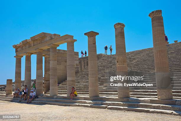 JUlLY 04: Tourists at the so called Stairway to Heaven at the Acropolis of Lindos on July 04, 2010 in Lindos, Greece. The old town of Lindos is...