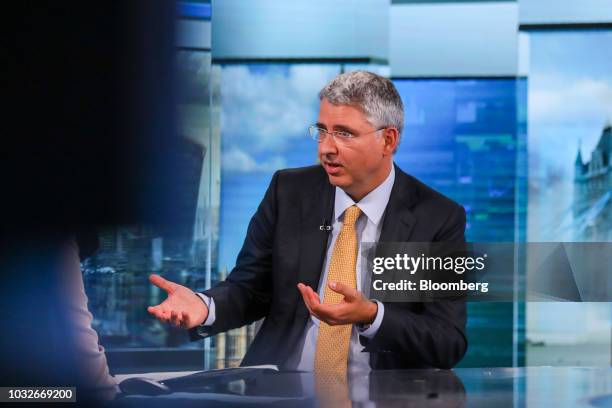 Severin Schwan, chief executive officer of Roche Holding AG, gestures while speaking during a Bloomberg Television interview in London, U.K., on...