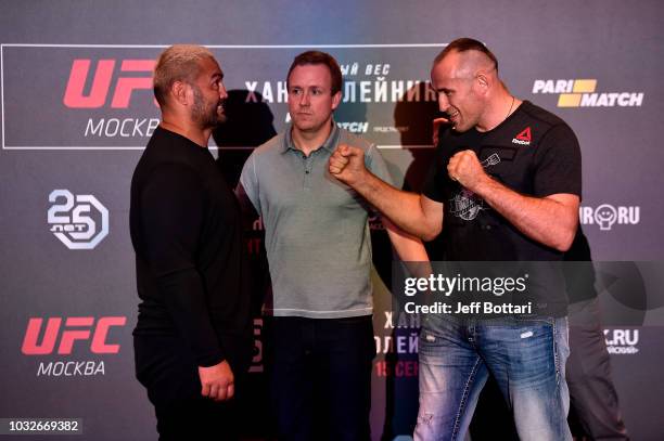 Opponents Mark Hunt of New Zealand and Aleksei Oleinik of Russia face off during the UFC Fight Night ultimate media day on September 13, 2018 in...