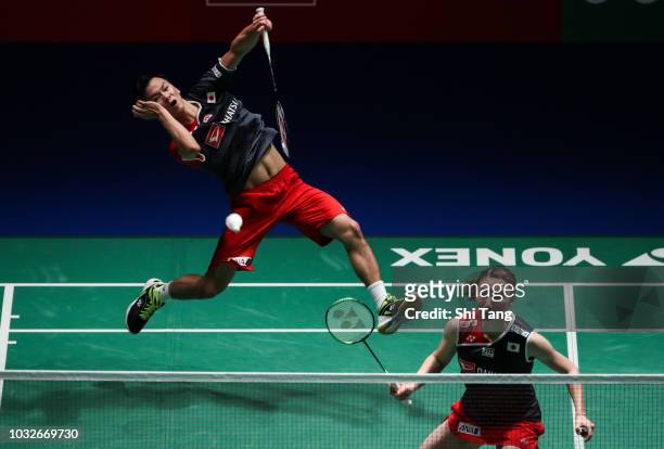 Yuta Watanabe and Arisa Higashino of Japan compete in the Mixed Doubles second round match against Tang Chun Man and Tse Ying Suet of Hong Kong on...
