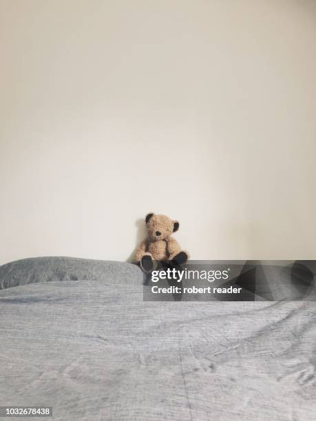 teddy bear on bed - teddy bear stock pictures, royalty-free photos & images