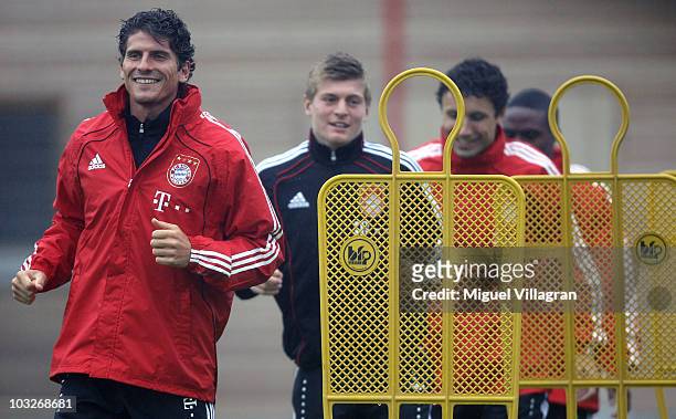 Mario Gomez, Toni Kroos, Mark van Bommel and Edson Braafheid exercise during the FC Bayern Muenchen training session at Bayern's training ground...