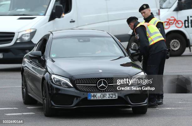 Police stop an arriving Mercedes car at the conclusion of the funeral of Nidal R. Near the New 12 Apostles cemetery during the funeral of Nidal R. On...