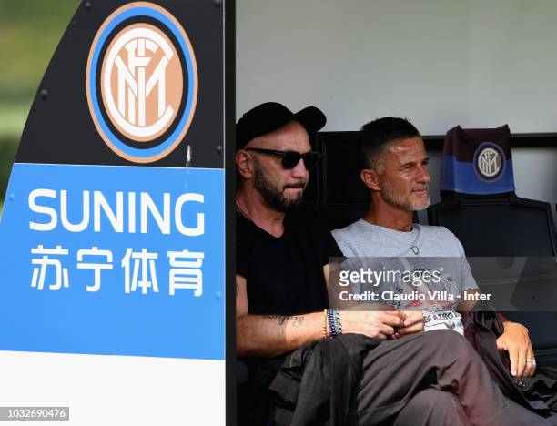 Walter Zenga and Benito Carbone watch the FC Internazionale training session at the club's training ground Suning Training Center in memory of Angelo...